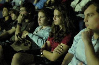  
Marli Scharlin, 15, and the other filmmakers watch the first movie during the Young Filmmakers Institute screening at Jewish Film Festival inside the Regal South Beach Theater in Miami Beach.